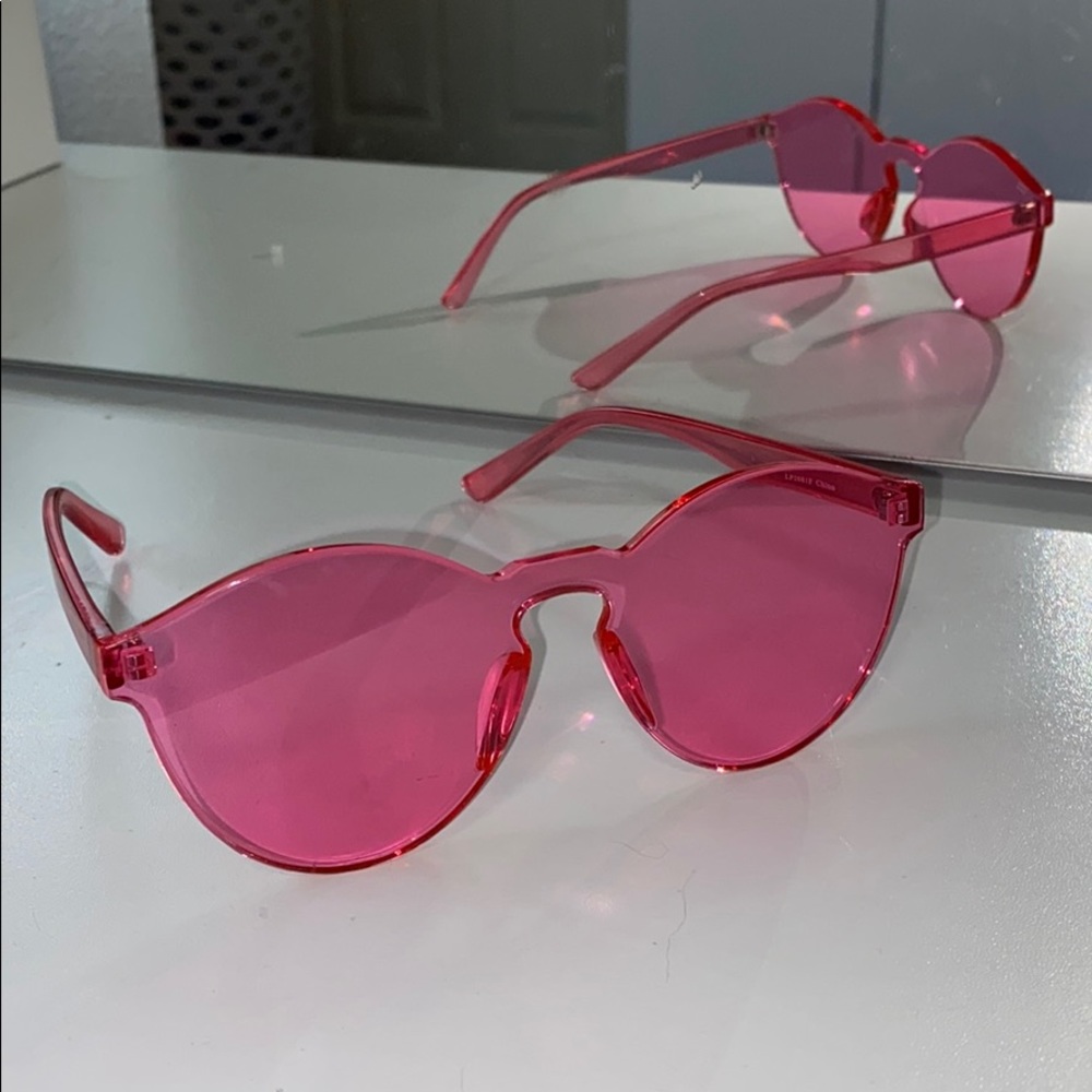 Round pink tinted sunglasses